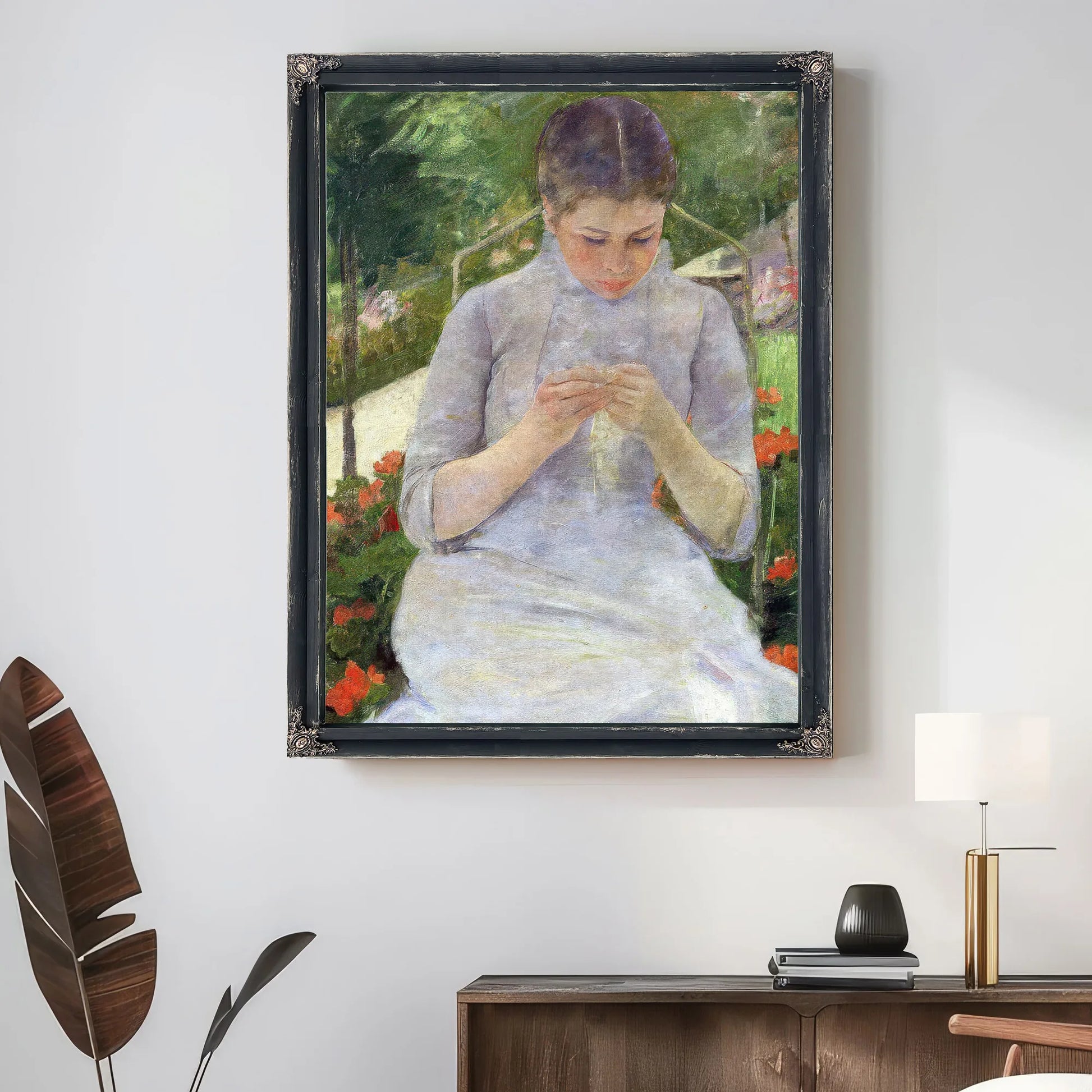 Young Woman Sewing In The Garden By Mary Cassatt Fine Art Print