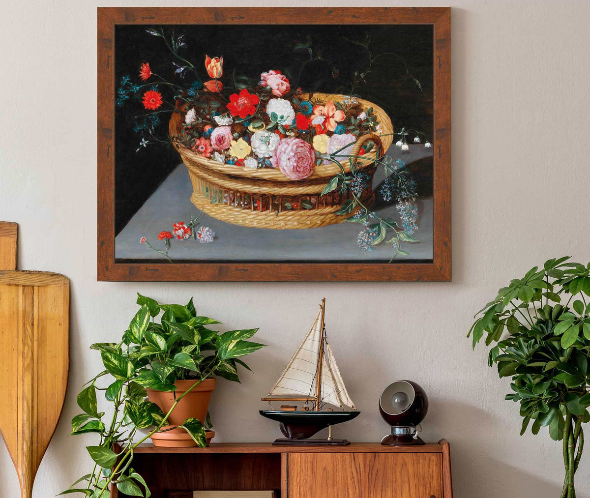 A Basket With Spring Flowers On A Stone Table by Jan Brueghel The Younger