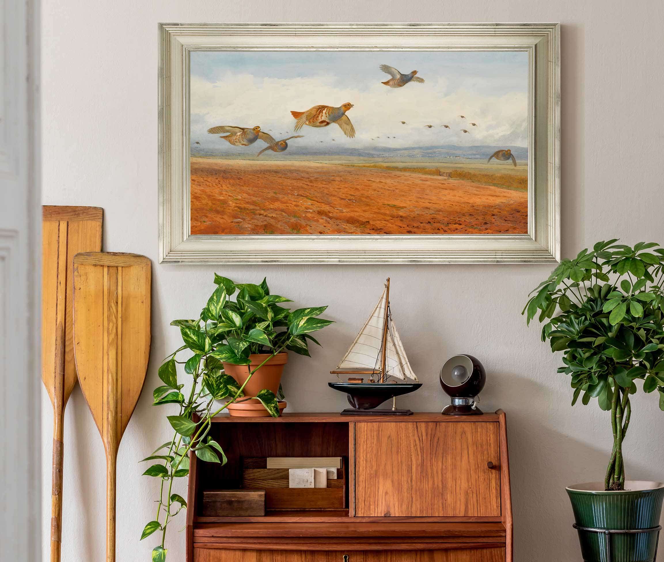 A Covey Of Grey Partridge In Flight by Archibald Thorburn