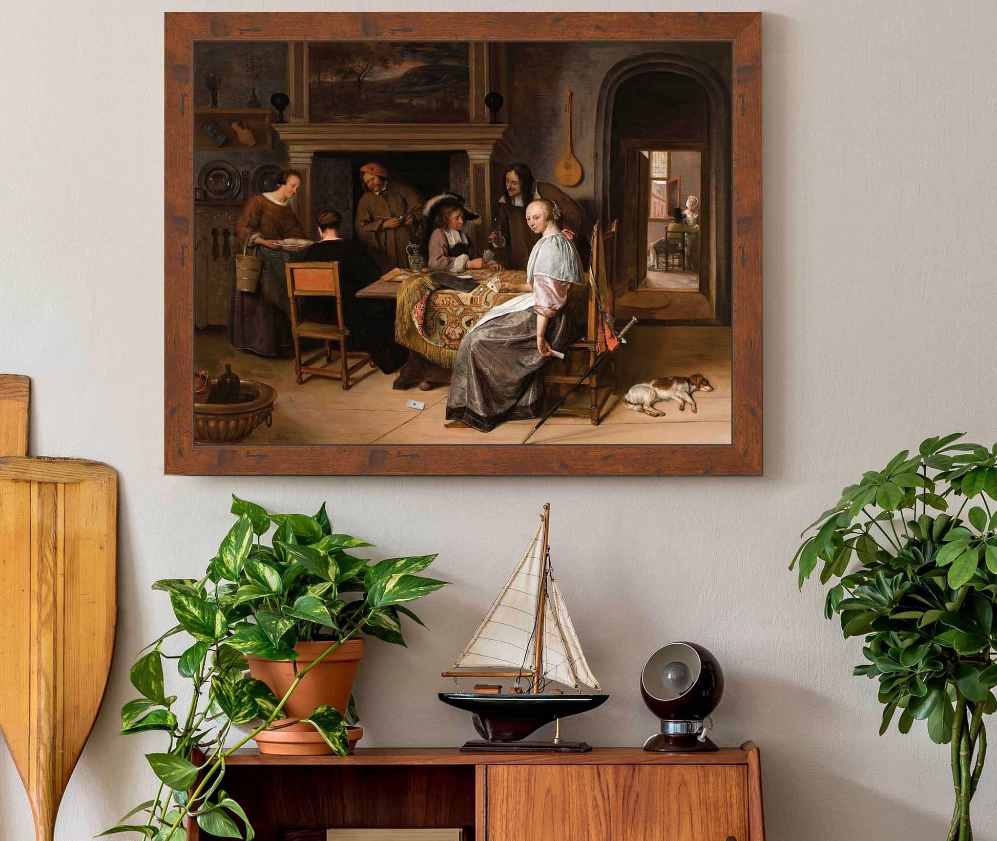 An Elegant Company In An Interior With Figures Playing Cards At A Table by Jan Steen
