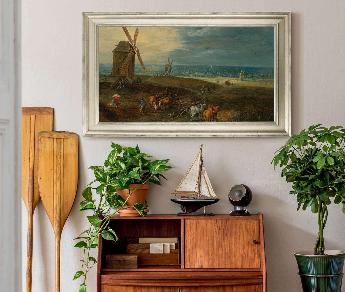 An Extensive Landscape With Travellers Before A Windmill by Jan Brueghel The Younger