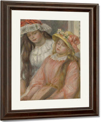 Young Girls Looking At An Album By Pierre Auguste Renoir Fine Art Print