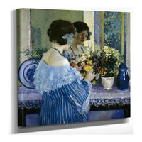 Girl In Blue Arranging Flowers by Frederick Carl Frieseke