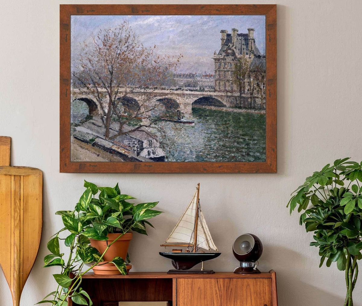 Le Pont Royal Et Le Pavillon De Flore by Camille Pissarro