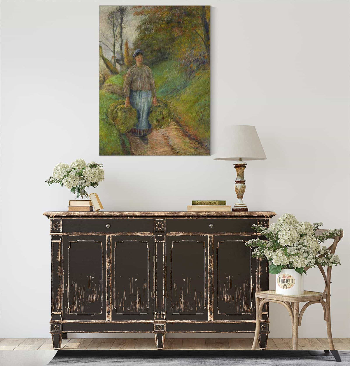 Peasant Woman Carrying Two Bundles Of Hay by Camille Pissarro