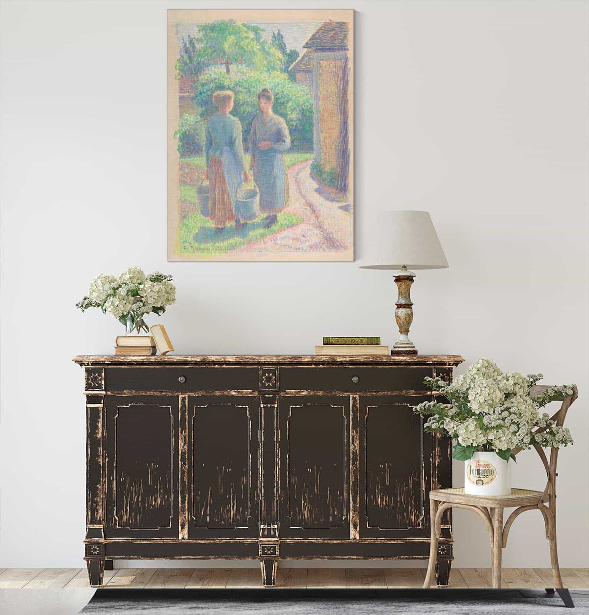 Two Women In A Garden by Camille Pissarro