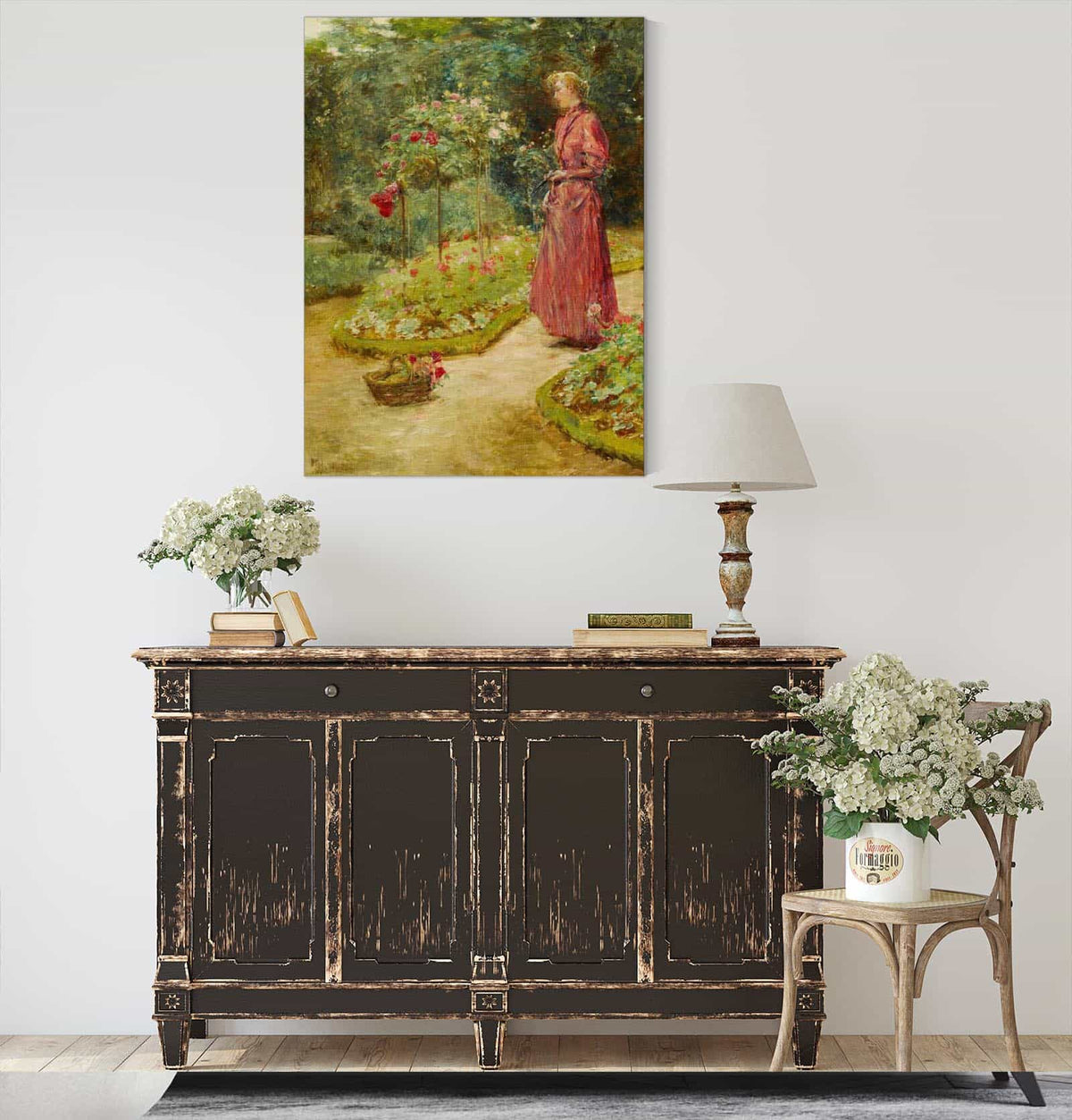 Woman Cutting Roses In A Garden by Childe Hassam