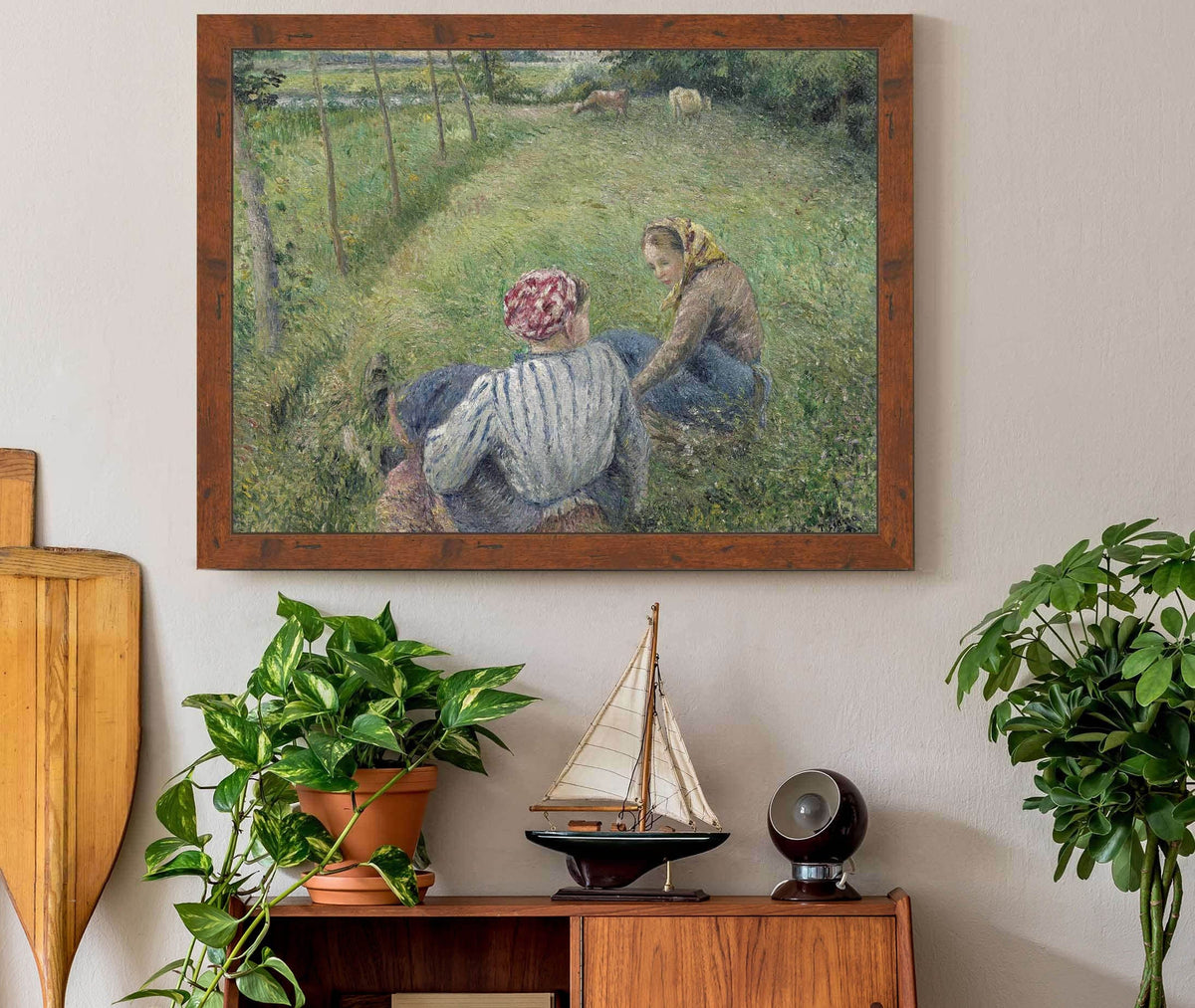 Young Peasant Girls Resting In The Fields Near Pontoise by Camille Pissarro